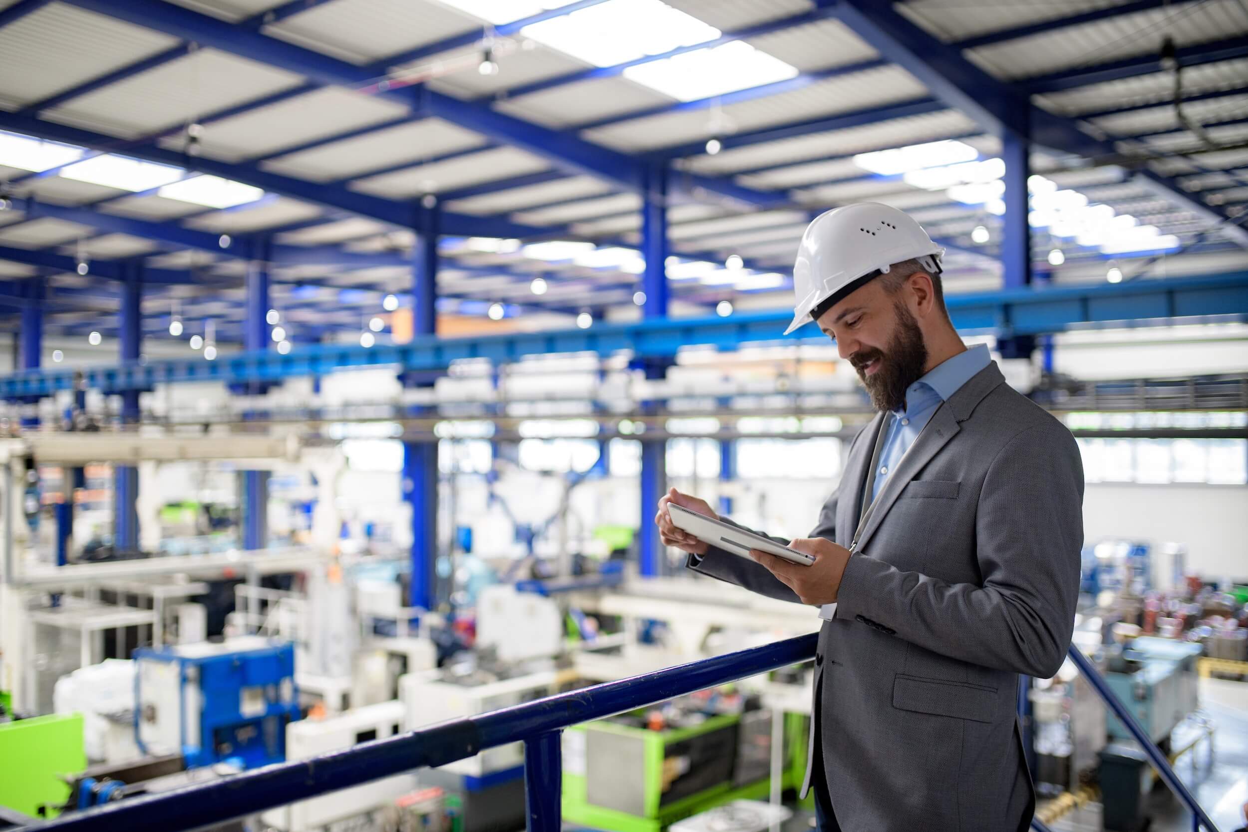 Manufacturing Leader Reviewing Metrics on Ipad