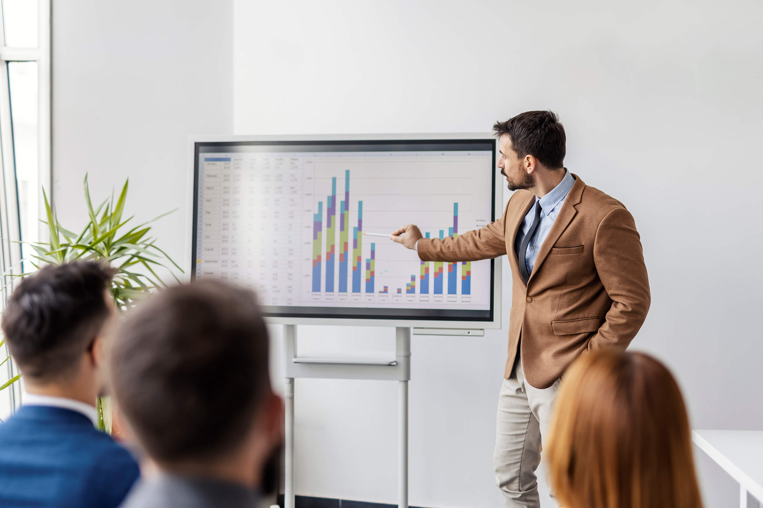 Man reading financial chart in his ERP platform.