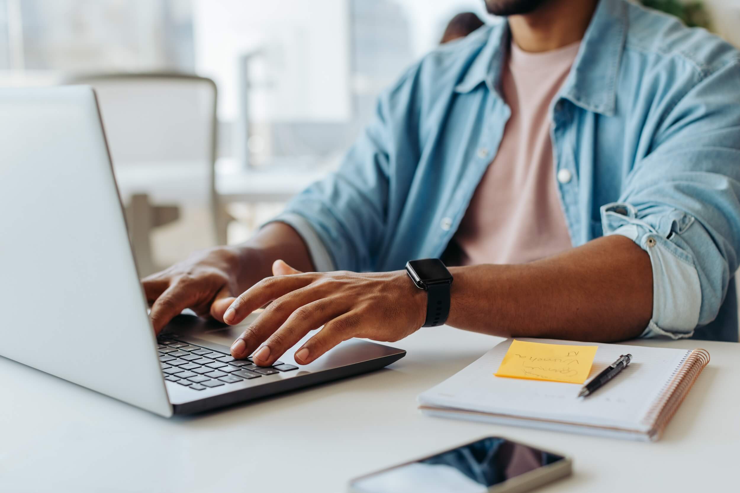 Man typing on a computer